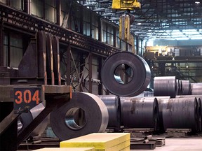 A coils of steel is moved by a crane at the Direct Strip Production Complex at Essar Steel Algoma in Sault Ste. Marie, Ont., on Wednesday, March 14, 2018. The Trump administration is promising to hit Canada with big steel and aluminum tariffs as of midnight Thursday night. THE CANADIAN PRESS/Justin Tang ORG XMIT: CPT109