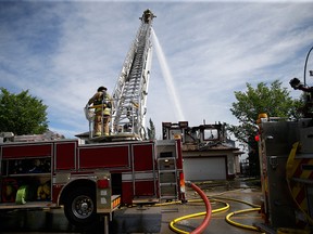 Calgary firefighters battle a fire in the city's Coventry Hills neighbourhood.