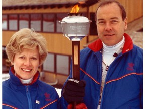 Frank King with Jeanette King and Torch.jpg.jpeg Frank King, mastermind of the 1988 Calgary Winter Olympics, died in Calgary on Wed., May 9, 2018. Photo courtesy King family.