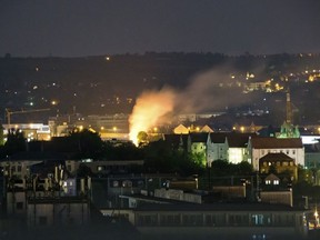 In this May 23, 2018 photo a burning spot lights in the Easter German City Dresden, after an attempt to defuse a Second World War bomb by remote control leads to a partial detonation of the bomb. German police confirmed the bomb that partially exploded during its diffusing has been successfully deactivated. (Marco Klinger/dpa via AP)