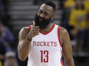 Houston Rockets guard James Harden (13) gestures during Game 4 of the NBA Western Conference Finals against the Golden State Warriors in Oakland, Calif., Tuesday, May 22, 2018. (AP Photo/Marcio Jose Sanchez)