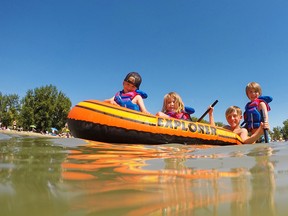 The Hutchinson family plays at Sikome Lake on a hot Wednesday afternoon July 26, 2017. The lake is having a much busier year after last summer's wet cool weather. Gavin Young/Postmedia