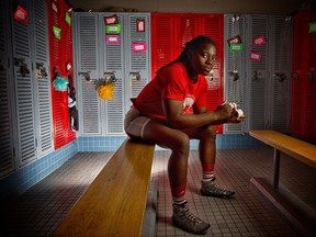 Temitope Ogunjimi, a University of Calgary wrestler/rugby athlete, has won five Canada West wrestling gold medals and two rugby conference championships, poses at the university on Thursday April 26, 2018. Leah Hennel/Postmedia