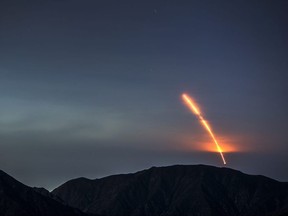 The Atlas 5 rocket carrying the Mars InSight probe launches from Vandenberg Air Force Base, as seen from the San Gabriel Mountains more than 100 miles away, near Los Angeles, on Saturday, on May 5, 2018.