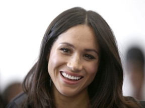 Meghan Markle attends a reception with Britain's Prince Harry for the Commonwealth Youth Forum at the Queen Elizabeth II Conference Centre, London, during the Commonwealth Heads of Government Meeting, Wednesday April 18, 2018. A dog adopted from an Ontario rescue home has proved to be of royal pedigree after having been whisked off to the United Kingdom to live with owner Meghan Markle and Prince Harry.