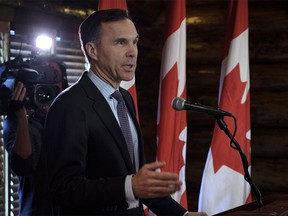 Minister of Finance Bill Morneau speaks to the media in Calgary, Alta., Wednesday, May 30, 2018.THE CANADIAN PRESS/Jeff McIntosh ORG XMIT: JMC101