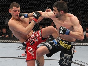 Carlos Condit (right) punches Nick Diaz during UFC 143 at Mandalay Bay Events Center on February 4, 2012 in Las Vegas. (Nick Laham/Zuffa LLC/Zuffa LLC via Getty Images)
