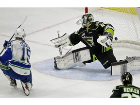 Swift Current Broncos captain Glenn Gawdin (left) scores on Edmonton  Oil Kngs goalie Travis Child during WHL game action in Edmonton on Sunday December 10, 2017.