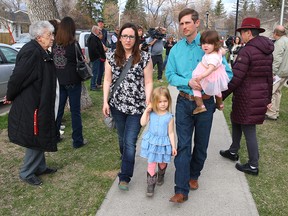 Edouard Maurice walks to the Okotoks Provincial Court Building with his family on Friday, May 4, 2018. The local landowner is charged with aggravated assault, pointing a firearm and careless use of a firearm, following a robbery at his ranch on Feb. 24, 2018.