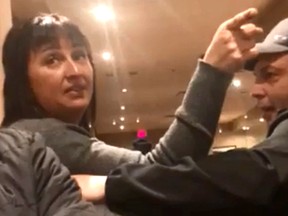 A woman engages in an argument with a group of patrons at a restaurant in Lethbridge in this screengrab from an undated video posted on Facebook by Monir Omerzai.