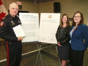 Calgary Police Chief Roger Chaffin, Alberta Minister of Status of Women Stephanie McLean and Minister of Justice and Solicitor General Kathleen Ganley pose for a photo after a press conference announcing a new best practice guide for police investigating sexual violence cases. Friday, May 25, 2018. Dean Pilling/Postmedia