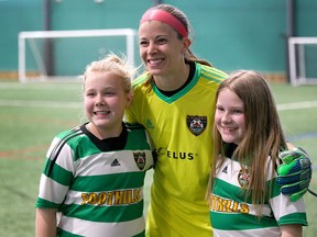 Calgary Foothills FC Goalkeeper Stephanie Labbè poses with supporters in Calgary on Saturday, March 17, 2018 following a friendly match against University of Lethbridge Pronghorns.