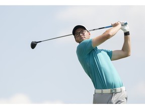 Airdrie's Riley Fleming follows through on a drive at the 11th tee box during Round 2 of the ATB Financial Classic, part of the Mackenzie Tour-PGA Tour Canada, at Country Hills Golf Club on Friday, August 11, 2017 in Calgary, Alta. Britton Ledingham/Postmedia Network