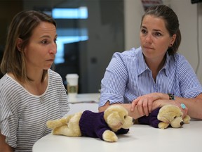 Amélie-Frédérique Gagnon, left and Geneviève Simard, two victims of Bertrand Charest, during a press conference at theSheldon Kennedy Child Advocacy Centre Calgary, on Friday June 8, 2018. Leah Hennel/Postmedia