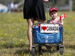 Brinley Duffy, 1, shows her Canadian pride during Canada's sesquicentennial celebrations at Fort Calgary in Calgary Saturday July 1, 2017. Leah Hennel/Postmedia