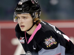 Calgary Hitmen Riley Stotts during warm-up at the Scotiabank Saddledome in Calgary, Alberta, on Friday, December 1, 2017. Leah Hennel/Postmedia