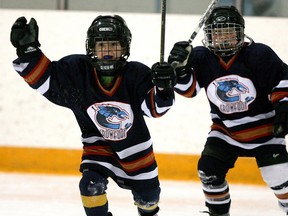 Crowfoot Novice 4 Coyotes, Jake McDermott, celebrates a goal during Minor Hockey action at the Family Leisure Centre in N.E. Calgary.n/a ORG XMIT: 0080202minor_dm0952.jpg0