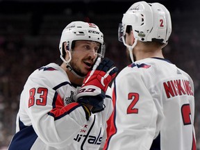 Jay Beagle #83 and Matt Niskanen #2 of the Washington Capitals discuss the play against the Vegas Golden Knights during the second period in Game Two of the 2018 NHL Stanley Cup Final at T-Mobile Arena on May 30, 2018 in Las Vegas.
