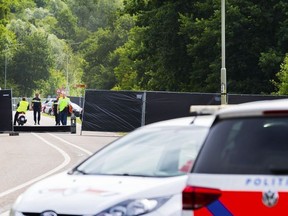 A picture taken near the site of the Pinkpop festival in Landgraaf, on June 18 2018, shows police cars after a van slammed into pedestrians, killing one and injuring three. The four pedestrians were hit around 4:00 am (0200 GMT) on June 18, 2018 by the van which then fled the scene, only hours after the end of the three-day Pinkpop Festival in the southern town of Landgraaf, near the German border.