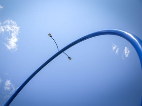 Travelling Light also known as  "The Giant Blue Ring" on 96 Avenue NE. Al Charest/Postmedia