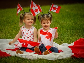 Twin sisters Olivia and Penelope Morrison pose for a Canada Day on Friday, June 29, 2018. Al Charest/Postmedia