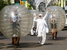 The Beakerhead crew launched their 2018 program and their September lineup by turning giant electrons and protons loose on Stephen Avenue which are so tiny you canít see them with the naked eye ñ until now in Calgary on Thursday June 7, 2018.