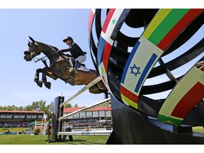 Israel's Ashlee Bond riding Cornetiero competes in the PwC Cup on day two at the Spruce Meadows National, Thursday June 7, 2018.  Gavin Young/Postmedia