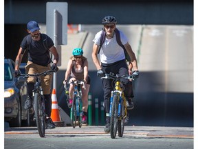 Cyclists ride out of downtown into Calgary's beltline on the 5th street bike lane on Wednesday June 27, 2018. Gavin Young/Postmedia