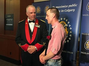 Chief Roger Chaffin speaks to citizen award recipient Rodney Page at the annual Chief's Awards Gala in Calgary June 7, 2018.