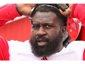 Calgary Stampeder Cordarro Law takes his helmet off on the sidelines following practice at McMahon Stadium in Calgary on Wednesday, May 30, 2018.