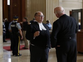 Lawyer Doug Elliott, the lead for the plaintiffs in the LGBTQ purge class action lawsuit, chats outside the courtroom in the Federal Court of Canada in Ottawa, on June 18, 2018.