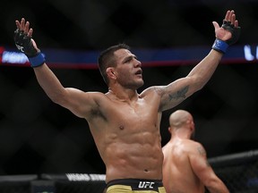 Rafael Dos Anjos celebrates a win over Robbie Lawler in main event action at the UFC Fight Night event in Winnipeg on Saturday, December 16, 2017. (THE CANADIAN PRESS/John Woods)