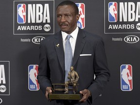 Dwane Casey, current head coach of the Detroit Pistons, poses in the press room with the coach of the year award for his work with the Toronto Raptors at the NBA Awards on Monday, June 25, 2018, at the Barker Hangar in Santa Monica, Calif. (Photo by Richard Shotwell/Invision/AP)