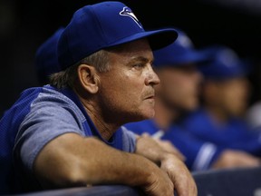 Manager John Gibbons of the Toronto Blue Jays looks on from the dugout during the fourth inning of a game against the Tampa Bay Rays on May 5, 2018
