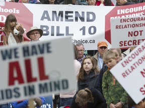Protestors gather at an anti-Bill 10 rally outside the McDougall Centre in Calgary on May 14, 2016.