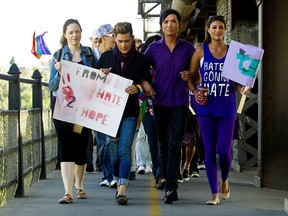 Chevi Rabbit, second from right, leads an anti-hate rally in Edmonton on Aug. 2, 2012. The rally was in response to an alleged hate crime attack on Rabbit, an Edmonton university student.