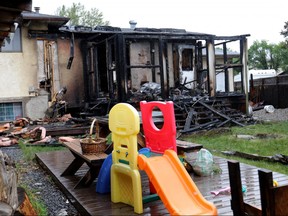 Remains of a early morning fire on Temple Rd. N.E. in Calgary on Sunday June 10, 2018. Darren Makowichuk/Postmedia