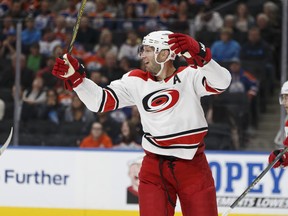 Carolina's Elias Lindholm (28) celebrates Teuvo Teravainen's second goal during the first period of a NHL game between the Edmonton Oilers and the Carolina Hurricanes at Rogers Place in Edmonton, Alberta on Tuesday, October 17, 2017. Photo by Ian Kucerak