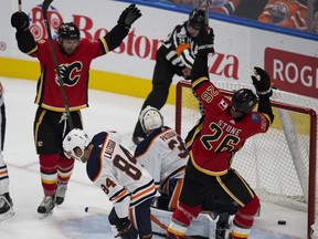 Calgary Flames Emile Poirier and Michael Spoon celebrate a goal on Edmonton Oilers goalie Edward Pasquale that was scored after the second period buzzer on Monday September 18, 2017 in Edmonton.   Greg  Southam / Postmedia