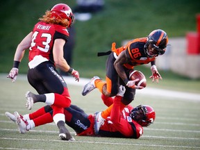 BC Lions Samajie Grant makes a catch in front of Keith Reineke and Tre Roberson Calgary Stampeders during CFL pre-season football in Calgary on Friday, June 1, 2018. Al Charest/Postmedia