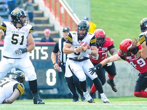 CALGARY, AB - JUNE 16: Jeremiah Masoli #8 of the Hamilton Tiger-Cats carries the ball against the Calgary Stampeders during a CFL game at McMahon Stadium on June 16, 2018 in Calgary, Alberta, Canada. (Photo by Derek Leung/Getty Images)