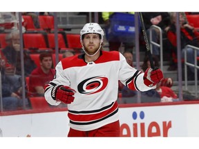 FILE - In this Jan. 20, 2018 file photo Carolina Hurricanes center Elias Lindholm celebrates his goal against the Detroit Red Wings in the first period of an NHL hockey game in Detroit. The Hurricanes have acquired defenseman Dougie Hamilton as part of a blockbuster trade with the Calgary Flames at the NHL draft. Carolina got Hamilton, winger Micheal Ferland and prospect Adam Fox from Calgary for Lindholm and defenseman Noah Hanifin.