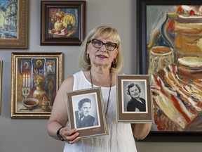 Olesia Luciw-Andryjowycz, with the Ukrainian Canadian Congress, holds the photos of her parents Olesia and Wolodymyr Luciw who immigrated to Canada from the Ukraine, escaping the ravages of the Second World War and communism, in Edmonton, on Friday, June 22, 2018. The Congress strongly objects to the Hammer and Sickle Vodka label which Alberta will no longer be stocking due to the offensive label.