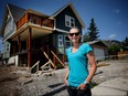 Michelle Faerden outside the home that she and her husband bought from the flood damaged neighbourhood of Beachwood Estates in High River and moved it to Exshaw, Alta. Leah Hennel/Postmedia