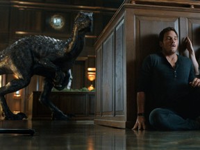 This image released by Universal Pictures shows Chris Pratt in a scene from the upcoming "Jurassic World: Fallen Kingdom." (Universal Pictures via AP)