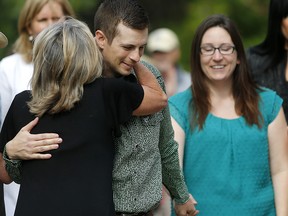 Edouard and Jessica Maurice are greeted by supporters outside the provincial courthouse in Okotoks on Friday, June 22, 2018. Maurice, who was accused of firing on trespassers during a confrontation on his property, had all charges against him dropped.