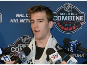 Noah Hanifin talks with reporters after he completed his hockey testing at the NHL Combine, Saturday, June 6, 2015, in Buffalo, N.Y.