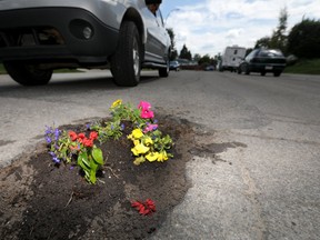 Residents on Markerville Road NE. have come up with alternatives to filling their potholes as calls to the city have had no results in Calgary on Tuesday June 19, 2018. Darren Makowichuk/Postmedia