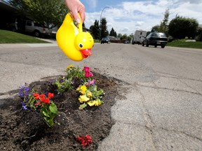 Residents on Markerville Road NE. have come up with alternatives to filling their potholes as calls to the city have had no results in Calgary on Tuesday June 19, 2018. Darren Makowichuk/Postmedia