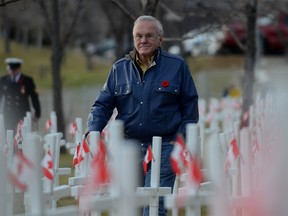 Murray McCann walks through the field of over 3000 crosses on Memorial Drive in downtown Calgary, Alta. on Tuesday November 4, 2014. McCann is the founder of the Field Of Crosses which pays tribute to the men and women from Southern Alberta who gave the ultimate sacrifice and were killed in the line of duty. This year however, a cross for Cpl. Nathan Cirillo and Warrant Officer Patrice Vincent were also added. Stuart Dryden/Calgary Sun/QMI Agency